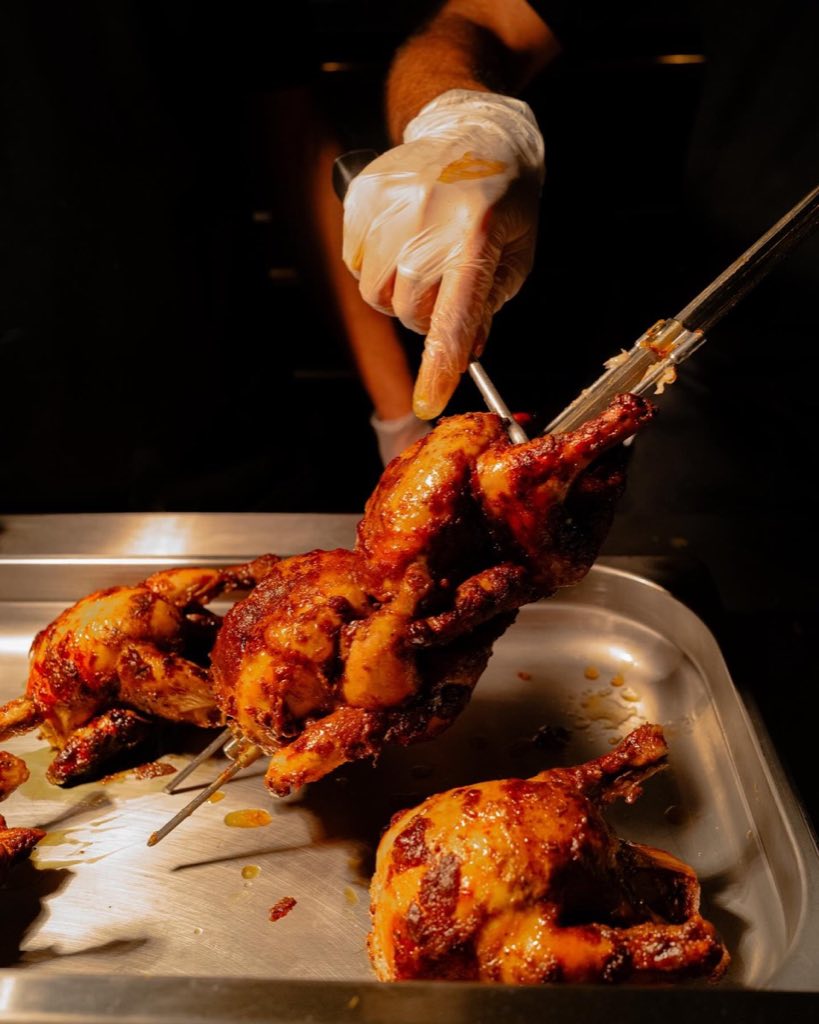 BRD rotisserie chicken coming off the spit